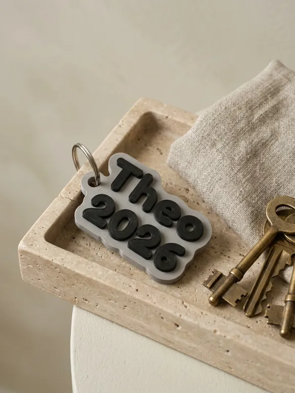 Keychain with two lines, Theo and 2026, typed into the Keychains generator.