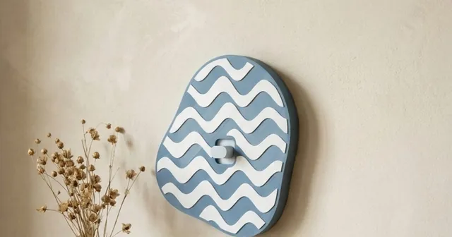 Scalloped round switch plate with a ray pattern, sized to the switch in the Switch Plates generator.
