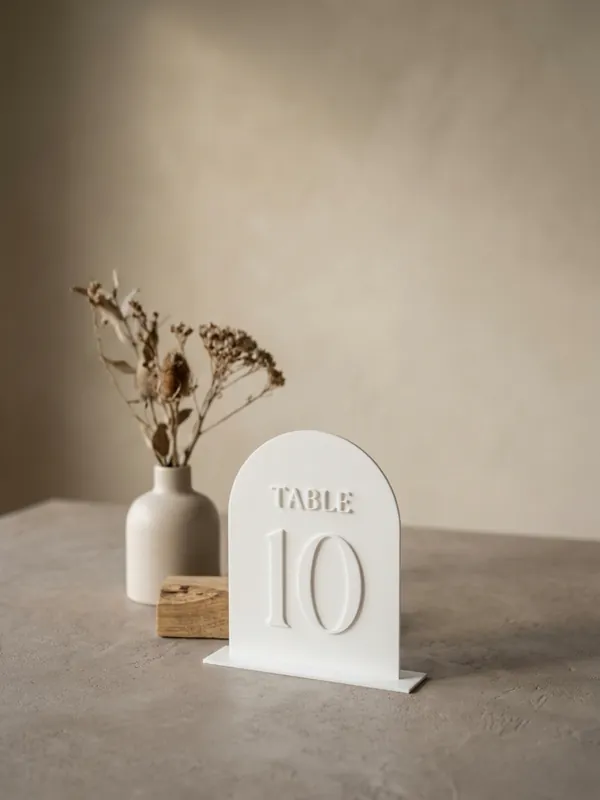 White arched table number 10 with a TABLE caption.